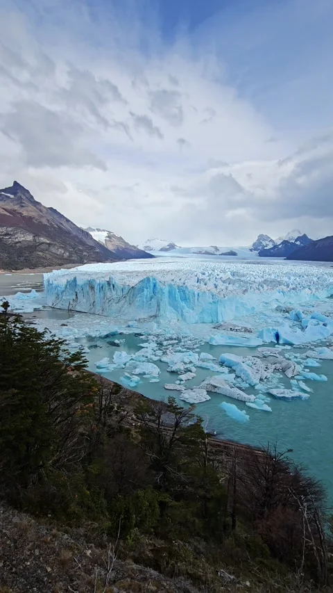Glacier Face With Floating Ice And Cloudy Sky, Perito Moreno Glacier, Argentina Stock Footage 306470663
