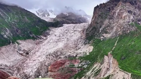Glacier Flowing Down Steep Mountainside in Tibet China Video stock 346986012