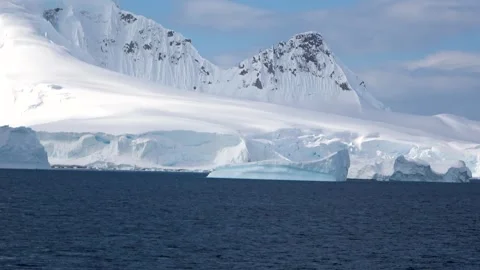 Glacier ice wall sailing past wide Antarctica, 4K Stock Footage 332393652