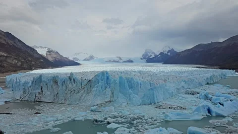 Glacier Ice Wall Under Gray Sky From Elevated Viewpoint, Argentina 8K Stock Footage 306470585