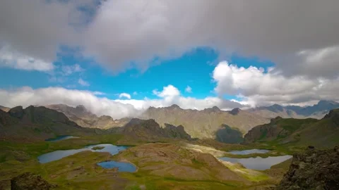 Glacier lakes and moving clouds over the mountains timelapse 4k video. Stock Footage 285719595