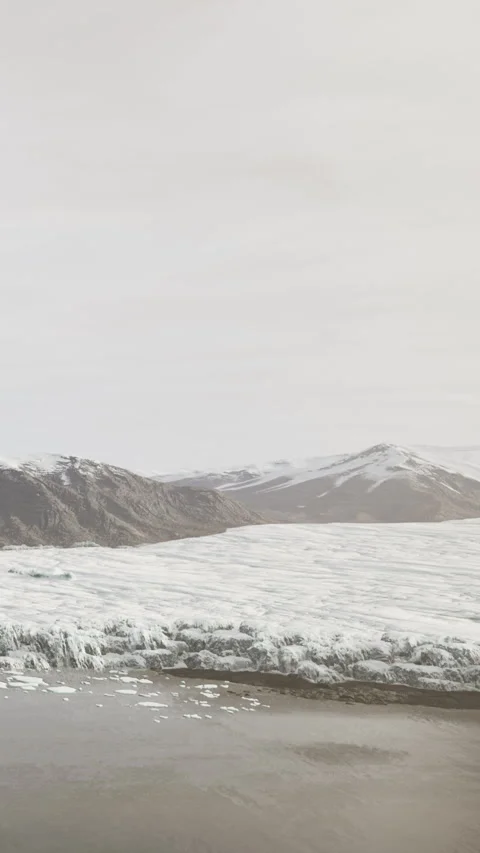 Glacier landscape with mountains in background and calm water at midday Stock Footage 337960824