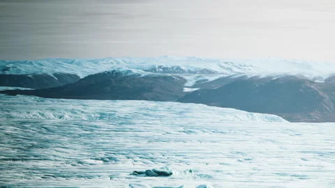 Glacier landscape with mountains in the background during daylight Stock Footage 339497977