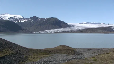 Glacier lower section just by a moraine-dammed lake of meltwater Stock Footage 37893065
