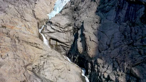 Glacier melting and forming a waterfall Stock Footage 166952953