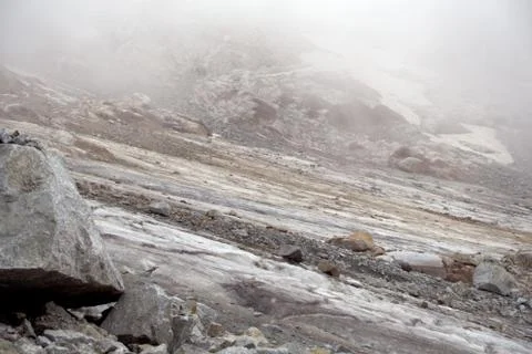 Glacier on a mountain pass. Stock Photos