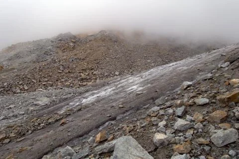 Glacier on a mountain pass. Stock Photos