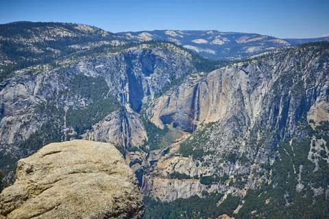Glacier Point Granite Cliffs Waterfall and Forested Mountains Yosemite National Stock Photos