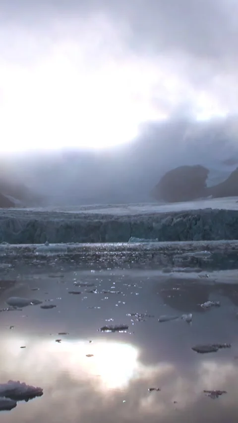 Glacier Reflects Cloudy Sky in Svalbard Waterscape Stock Footage 321018396