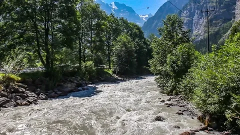 Glacier river in the Swiss alps Stock Footage 240090809
