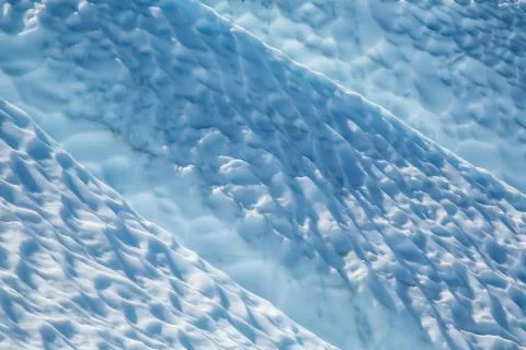 Glacier sun cup features between crevasses on the Matanuska Glacier. Stock Photos