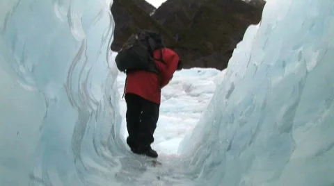 Glacier tunnel with guide Stock Footage 139149
