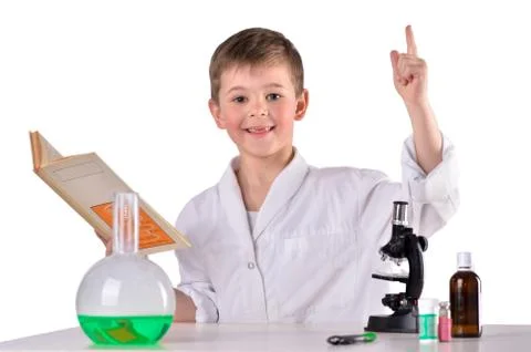 Glad science boy find solution in the book Stock Photos