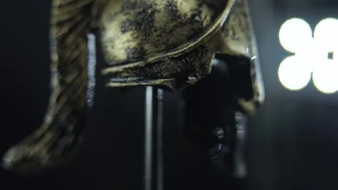 Gladiator helmet macro footage, 360 spin, water drop falls, dramatic cinematic Stock Footage 334136056