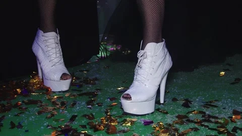 Glamorous arrival steps onto confetti-strewn stage at Mardi Gras Stock Footage 311894610