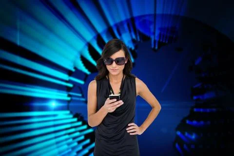 Glamorous brunette using smartphone against blue technology background Illustrazione stock