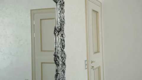 Glamorous man in suit corrects his look at luxurious mirror. 4K Stock Footage 86830989