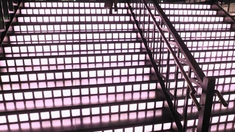 Glamorous model coming down the glowing stairs, cute woman walking down the step Stock Footage 106746917