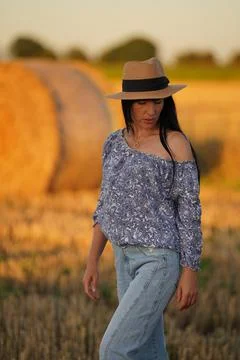 The glamorous model poses defiantly exposing her bare shoulder and pointedly Stock Photos