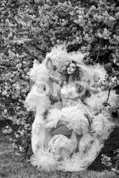 Glamour girl in pink blossom Stock Photos