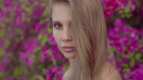 Glamour Lady Looking at Camera at Blooming Garden. Stock Footage 145348756
