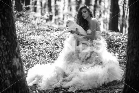 Glamour woman with goat in forest Stock Photos