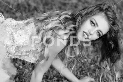 Glamour woman on green grass Stock Photos