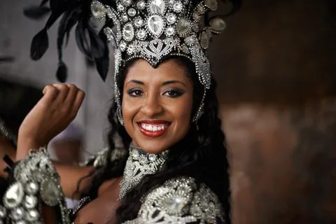 Glamourous dancing queen. a beautiful samba dancer wearing a headdress. Stock Photos