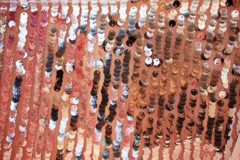 Glance background made of two-sided sequins material. Stock Photos