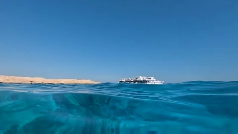 A glance at the ship from the surface of the water Stock Footage 256169083