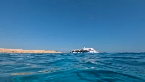 A glance at the ship from the surface of the water Stock Footage 256169333