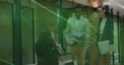 Glancing docs, man urging wheelchair-user in hall for work peer in blazer Stock Footage 331736137