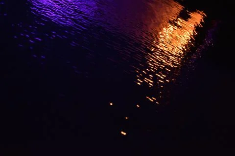 Glare and reflection of light on the water. Stock Photos