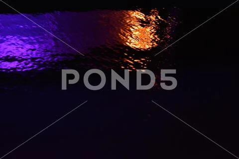 Glare and reflection of light on the water. Stock Photos