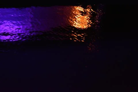 Glare and reflection of light on the water. Stock Photos