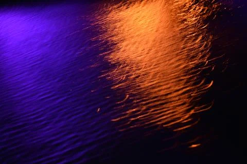 Glare and reflection of light on the water. Stock Photos