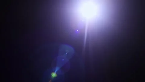 Glare on a black background. A camera pointed at the light produces a special fl Stock Footage 250323321