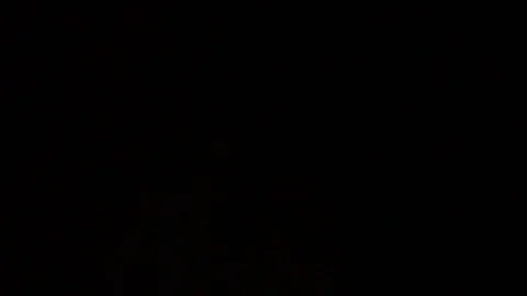 The glare of the flashlight in front of the camera,the thief is looking for loot Stock Footage 77162725