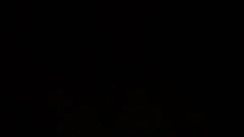 The glare of the flashlight in front of the camera,the thief is looking for loot Stock Footage 77164085