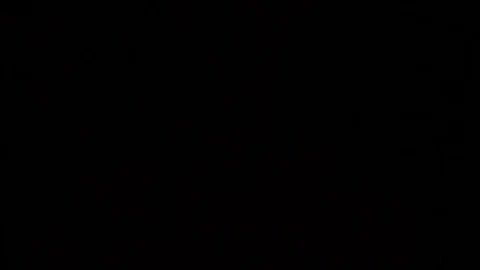 The glare of the flashlight in front of the camera,the thief is looking for loot Stock Footage 77164571