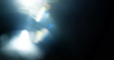 Glare of light in the lens on a black background Stock Footage 237883697