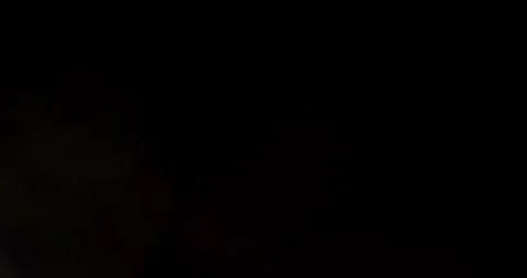 Glare of light in the lens on a black background 스톡 동영상 286870158