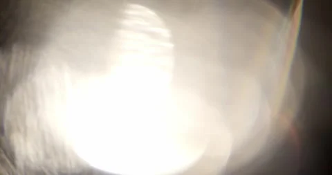 Glare of light in the lens on a black background Video stock 287421843