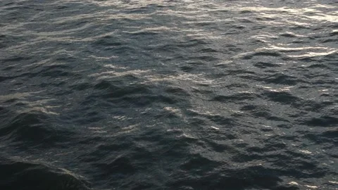 Glare of light on the water surface. Calming reflection of light on the waves Stock Footage 138587502