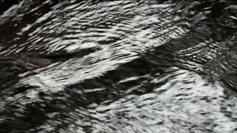 Glare on running water Stock Footage 84649987