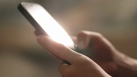 Glare on the smartphone screen from the sun. Stock Footage 169560471