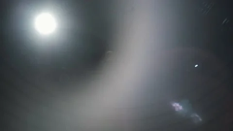 Glare from the spotlight under the dome of the circus. Looking up from  Stock Footage 168373851