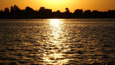 Glare of the sun on the dark waters of the river Stock Footage 85362982