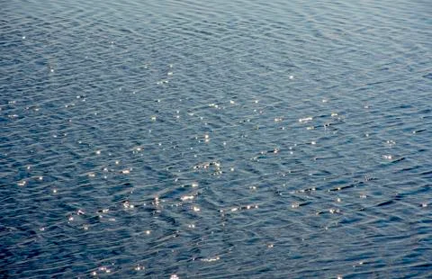 The glare of the sun on the river wave Stock Photos