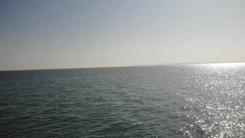 The glare of the sun in the sea view from the drone Stock Footage 236512347